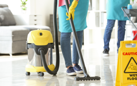 Cleaner vacuuming the floor