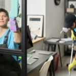two people cleaning an office space