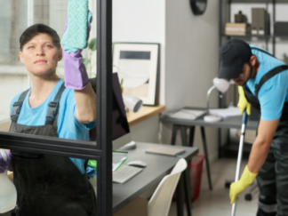 two people cleaning an office space