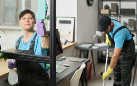 two people cleaning an office space